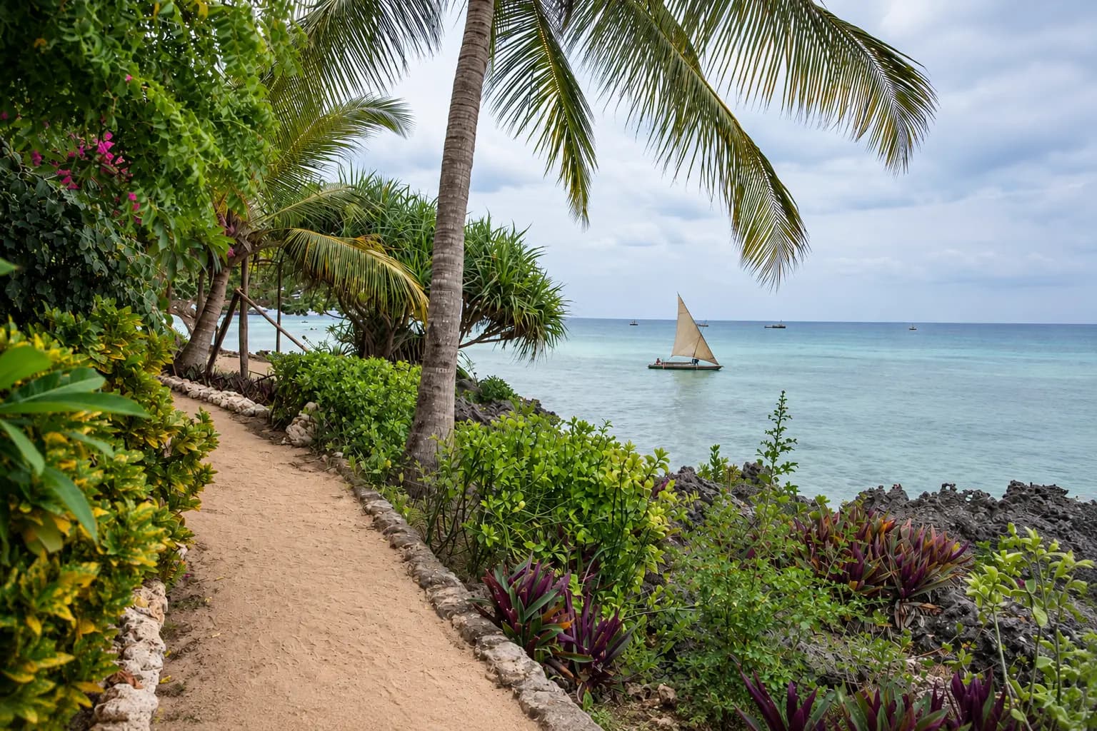 Green gardens and the blue Indian Ocean at Veridiana Hotel Zanzibar